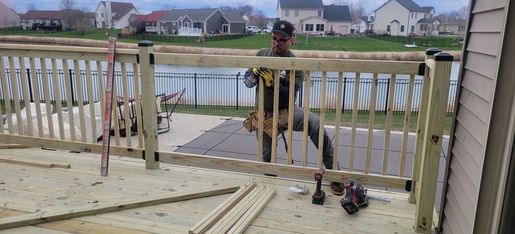 Residential deck construction with railings
